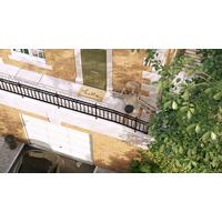 Židlový výtah Unizdrav se zatočenou kolejnicí