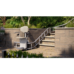 Židlový výtah Unizdrav se zatočenou kolejnicí