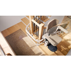 Židlový výtah Unizdrav se zatočenou kolejnicí