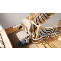 Židlový výtah Unizdrav se zatočenou kolejnicí